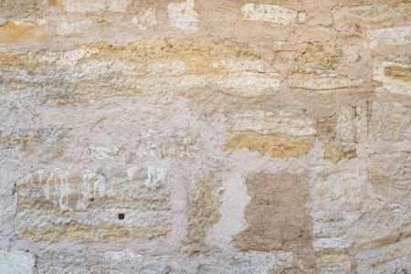 Old rough grey stone wall texture or backgroundの写真素材