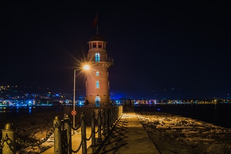 Lighthouse in the port of Alanya at nightの写真素材