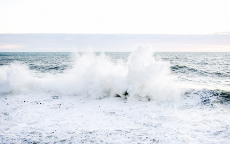 Big wave breaking over a cliff at Riomaggiore, liguria, Italy during a stormy winter dayの写真素材