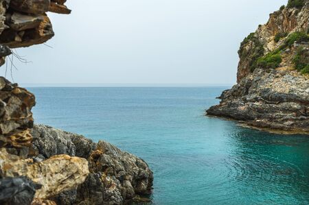 Turquoise sea bay with cliff in Turkey, Mediterranean region. Ancient Iotape townの写真素材