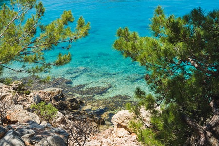 Mediterranean sea coast with clear sea water at Kastelorizo island on sunny day, Dodecanese, Greeceの写真素材