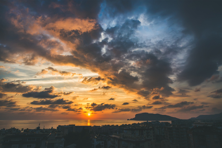 View from balcony of sunset over sea and evening dramatic sky, Alanya, Mediterranean Turkey coastの写真素材