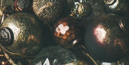 Flat-lay of vintage Christmas or New Year holiday tree decoration balls, top view. Holiday greeting card background, wide compositionの写真素材