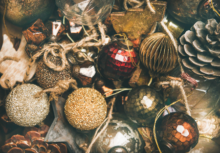 Christmas or New Year texture, wallpaper and background. Flat-lay of vintage Christmas tree decoration toys, balls and pine cones, top view, close-up. Festive holiday moodの写真素材