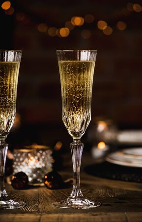 Christmas, New Year festive set, table with glasses of champagneの写真素材
