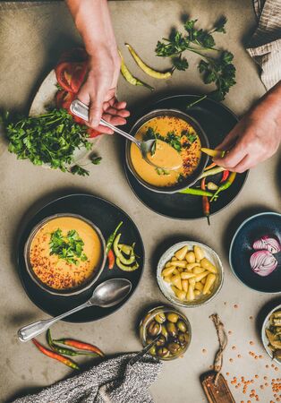 Flat-lay of man eating turkish traditional lentil soup Mercimekの写真素材