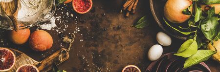 Blood orange cake ingredients. Flat-lay of fresh oranges, lemons, flour, eggs, cinnamon and cake...