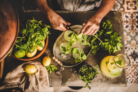 Hands of woman making fresh homemade lemonade.の写真素材