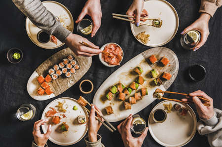 Friends quarantine Japanese sushi dinner from delivery serviceの写真素材