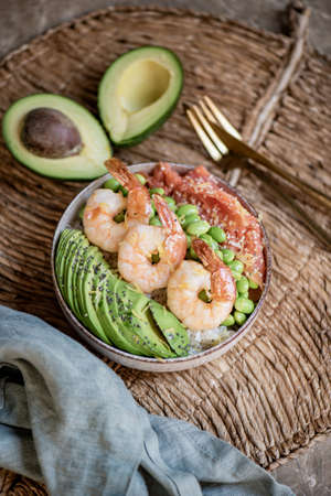 Healthy bowl with rice, avocado, shrimps, edamame and salmonの写真素材