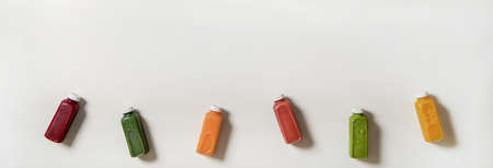 Flat-lay of fresh natural organic juices in bottles, copy spaceの写真素材