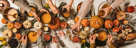 Family eating at Thanksgiving celebration party tableの写真素材