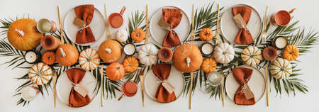 Ceramic plates, tableware and golden culery over white tableの写真素材