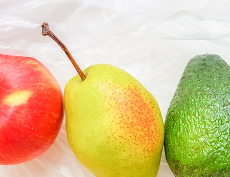 Ripe pear, avocado and banana closeup. Top viewの写真素材