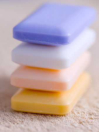 four bars of soap on a brown towelの写真素材