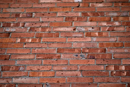 Background of an old pink and orange brick wall