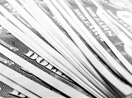Background ten dollar bills on the table close-up