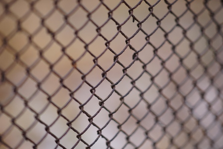 Old rusty mesh fence. Selective focusの写真素材