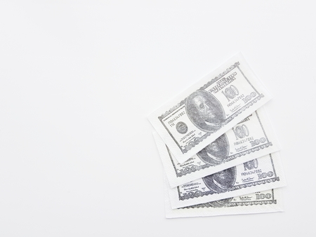 four one hundred dollars banknotes on a white background.の写真素材
