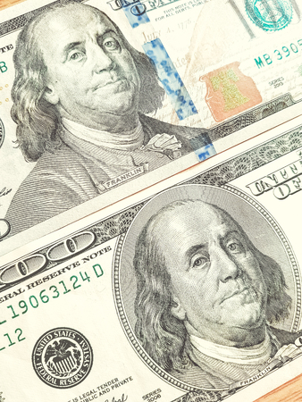 Macro shot of a new 100 dollar bills.