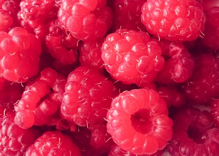 Ripe pink raspberry berries background. Flat lay, top view