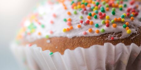 Easter cupcake wrapped in white closeup, holiday sweet food