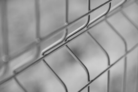 new grid fence close up, bw photo