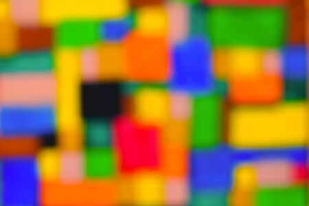 Colorful abstract background with many positive colors. Multicolor geometric shapes in blur. Blurred...