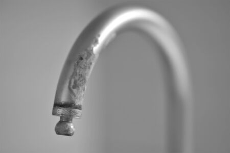 old chrome faucet in lime, art selective focus, bwの写真素材