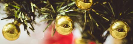 Christmas tree decorated with golden balls closeup