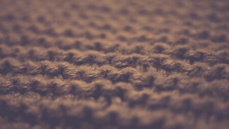 Knitted texture, brown thread pattern, cozy winter backgroundの写真素材