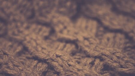 Knitted texture closeup, brown thread pattern, cozy winter backgroundの写真素材