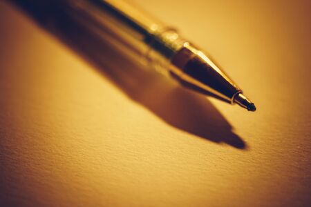 Closeup pen on a notebook paper, accessory for creativity on the table