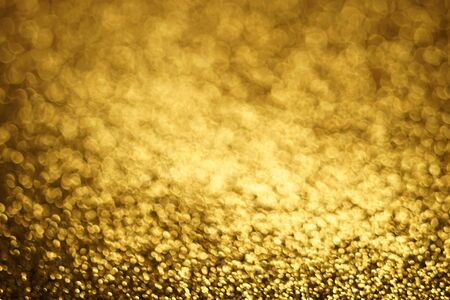 Golden glitter abstract background, gold sparkles blurry texture, New Year card