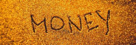 Text Money on golden rich shiny background.の写真素材