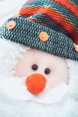 Portrait Santa Claus face with glasses and red hat, closeup toyの写真素材