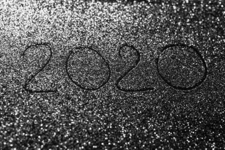 2020 number on shiny glitter, black and white background