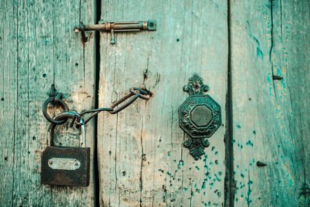 Old wooden door with handle, heck and lock. Boho styleの写真素材