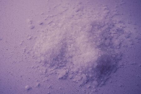 sea salt on the table, purple tone.