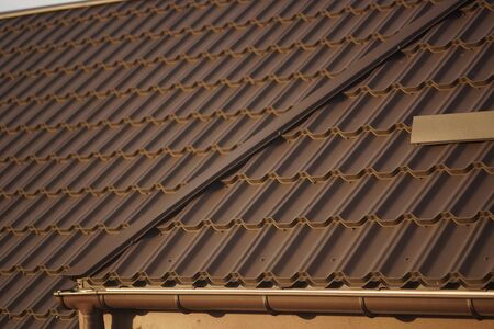Closeup of brown tiled roof in sunny day