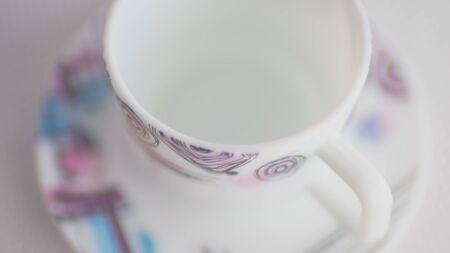 Mug and saucer on the table. Modern crockery for tea with a pattern. Selective art focusの写真素材