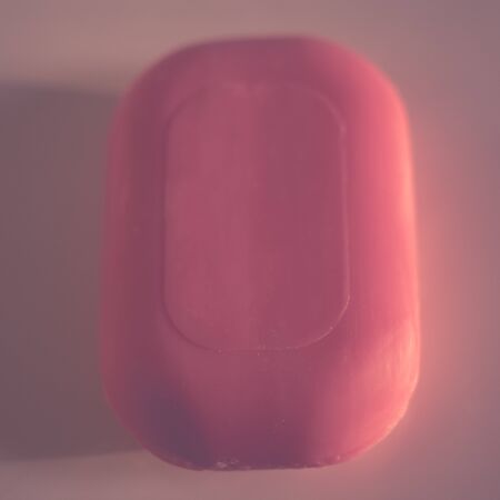 Pink bar of soap on a table closeup. Top viewの写真素材