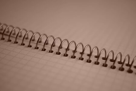 open notebook on a spiral, squared paper closeupの写真素材