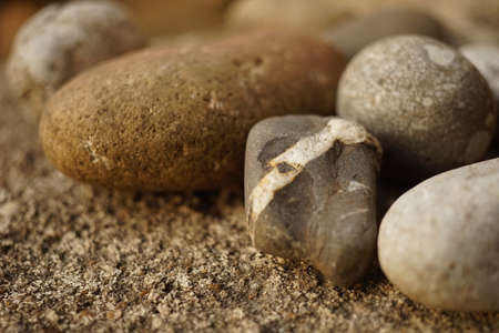 pebble stones closeup on the stone table.