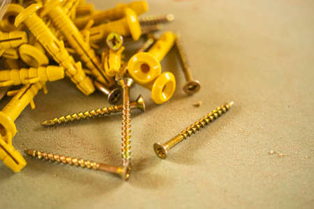 Set of new fasteners dowel nail on a dirty table.の写真素材