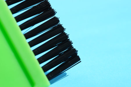 new green hair dye brush on blue table.の写真素材