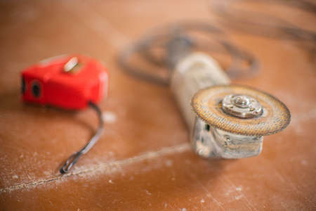 Grinding tool with abrasive cutting disc on the floor.の写真素材