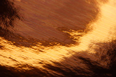 Rich copper or golden shiny background.