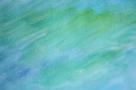 Pastel abstract background with blue green watercolor paints.の写真素材