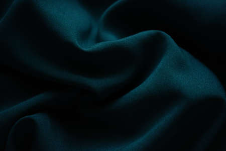 Closeup wrinkled green jersey, soft fabric background.の写真素材